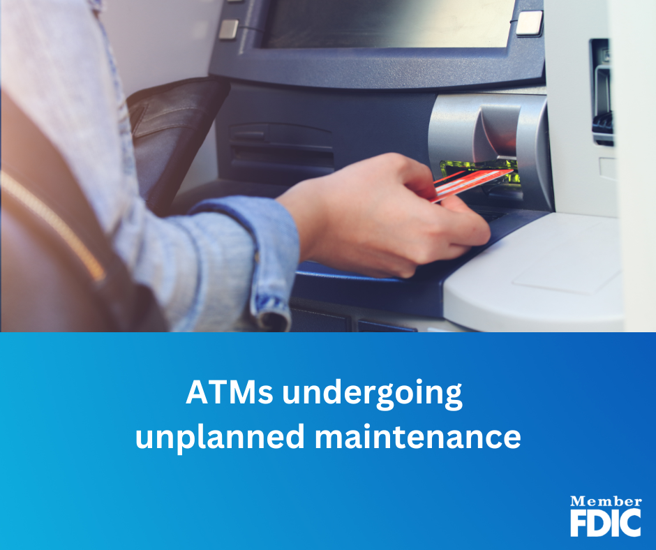 An individual is placing a card into an ATM.